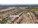 Wide aerial view of neighborhood featuring desert landscaping, private pools, and community solar farm at 8221 Bay Dunes St, Las Vegas, NV 89131