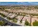 Expansive aerial view of a neighborhood, highlighting the beautifully landscaped homes and mountain views at 8221 Bay Dunes St, Las Vegas, NV 89131