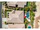 Overhead shot of a house with backyard pool, spa, patio, and landscaped garden in a residential neighborhood at 8221 Bay Dunes St, Las Vegas, NV 89131