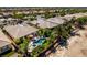 Aerial view of backyard with a uniquely shaped pool, spa, and lush landscaping at 8221 Bay Dunes St, Las Vegas, NV 89131