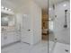 Bright bathroom with a marble shower and a view into the bedroom at 8221 Bay Dunes St, Las Vegas, NV 89131