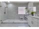 Bathroom featuring a frameless glass shower, modern fixtures, and a sleek vanity with a rectangular sink at 8221 Bay Dunes St, Las Vegas, NV 89131