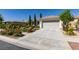 Beautiful single story home with a well maintained lawn and front yard and a two car garage at 8221 Bay Dunes St, Las Vegas, NV 89131
