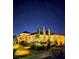 Well-lit home exterior at night, showcasing the landscaped front yard at 8221 Bay Dunes St, Las Vegas, NV 89131