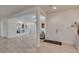 Home Foyer features light colored tile floors, neutral walls, mirrors, and multiple doorways at 8221 Bay Dunes St, Las Vegas, NV 89131