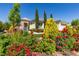 Landscaped front yard with vibrant flowers and manicured shrubbery at 8221 Bay Dunes St, Las Vegas, NV 89131