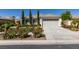 Well-maintained home featuring manicured landscaping and a two-car garage at 8221 Bay Dunes St, Las Vegas, NV 89131