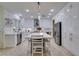 Beautiful kitchen with white cabinets, stainless appliances, and island seating at 8221 Bay Dunes St, Las Vegas, NV 89131