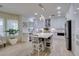 Contemporary kitchen with white cabinets, stainless appliances, and eat-in island at 8221 Bay Dunes St, Las Vegas, NV 89131