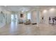 Airy and bright living room with tile floors, neutral walls, ceiling fan, and lots of light at 8221 Bay Dunes St, Las Vegas, NV 89131