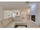 Spacious living room with fireplace, neutral color palette, and hardwood-style flooring at 8221 Bay Dunes St, Las Vegas, NV 89131
