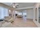 Spacious living room with fireplace, tile floors, ceiling fan, and neutral wall color at 8221 Bay Dunes St, Las Vegas, NV 89131