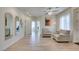 Open-concept living space with tile flooring, seating area, and lots of natural light at 8221 Bay Dunes St, Las Vegas, NV 89131