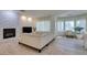 Bright living room with fireplace, large sectional sofa, and lots of natural light at 8221 Bay Dunes St, Las Vegas, NV 89131