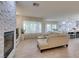 Spacious living room showing fireplace, kitchen, and dining area at 8221 Bay Dunes St, Las Vegas, NV 89131