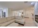 Open concept living space with fireplace, tile flooring, and seamless flow into other areas at 8221 Bay Dunes St, Las Vegas, NV 89131