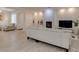 Spacious living room with a fireplace, neutral color palette, and hardwood-style flooring at 8221 Bay Dunes St, Las Vegas, NV 89131