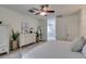 Spacious primary bedroom with white furniture and a view to the en suite bathroom and walk in shower at 8221 Bay Dunes St, Las Vegas, NV 89131
