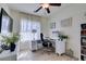 Bright office space with desk, chair, and a large window allowing for natural light and comfortable work setting at 8221 Bay Dunes St, Las Vegas, NV 89131