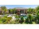 Private backyard oasis with a sparkling pool, hot tub, and lush garden at 8221 Bay Dunes St, Las Vegas, NV 89131