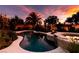 Scenic backyard pool view with water feature and surrounding lush landscaping at 8221 Bay Dunes St, Las Vegas, NV 89131