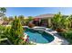 Relaxing pool surrounded by beautiful flowers, shrubs, and trees at 8221 Bay Dunes St, Las Vegas, NV 89131