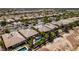 Aerial view capturing a neatly planned neighborhood with similar desert homes at 8221 Bay Dunes St, Las Vegas, NV 89131