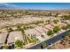 Aerial view showcasing a neighborhood with well-kept homes and neat desert landscaping at 8221 Bay Dunes St, Las Vegas, NV 89131