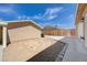 Spacious backyard featuring low maintenance landscaping, defined border, and an extended driveway at 839 Benita Pl, Boulder City, NV 89005