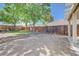 Backyard with lawn, trees, and partial fence at 839 Benita Pl, Boulder City, NV 89005