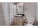Bathroom with vanity, toilet, shower curtain, and mirror at 839 Benita Pl, Boulder City, NV 89005
