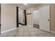 Bright open bathroom featuring tile floors, a shower, and closet access at 839 Benita Pl, Boulder City, NV 89005