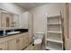 Well-lit bathroom with granite counters, custom cabinet, and open shower at 839 Benita Pl, Boulder City, NV 89005