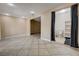 Spacious open tile floored bathroom with open shower and adjacent carpeted area at 839 Benita Pl, Boulder City, NV 89005