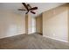 Carpeted bedroom with a ceiling fan, offering a blank canvas for customization at 839 Benita Pl, Boulder City, NV 89005