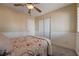 Cozy bedroom featuring a ceiling fan, neutral walls, and a closet at 839 Benita Pl, Boulder City, NV 89005