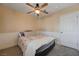 Bedroom featuring ceiling fan, window with shutters, and carpet flooring at 839 Benita Pl, Boulder City, NV 89005