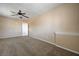 Spacious carpeted bedroom with ceiling fan and neutral color scheme, awaiting personalization at 839 Benita Pl, Boulder City, NV 89005