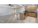 Spacious area featuring an island with bar seating, stainless steel appliances, and a back patio door at 839 Benita Pl, Boulder City, NV 89005