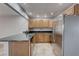 Modern kitchen featuring stainless steel appliances, granite countertops, and ample cabinet space with lots of natural light at 839 Benita Pl, Boulder City, NV 89005