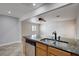 Kitchen island with granite countertop, stainless steel dishwasher, and a dual basin sink with a sleek faucet at 839 Benita Pl, Boulder City, NV 89005