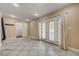 Bright living area featuring tile floors, French doors, and access to a walk-in closet at 839 Benita Pl, Boulder City, NV 89005