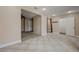 Bright living area with tile flooring, connecting bedroom to bath with closet at 839 Benita Pl, Boulder City, NV 89005
