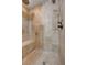 Shower with tiled walls, bench and multiple shower heads at 839 Benita Pl, Boulder City, NV 89005