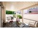 Charming covered back patio with barbecue and seating area for outdoor relaxation at 8437 Cinnamon Hill Ave, Las Vegas, NV 89129