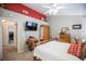Comfortable bedroom with unique decor, a ceiling fan, and ample closet space at 8437 Cinnamon Hill Ave, Las Vegas, NV 89129