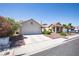 Lovely single-story home with a well-kept front yard, a spacious driveway, and desert landscaping at 8437 Cinnamon Hill Ave, Las Vegas, NV 89129