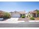 Inviting single-story home featuring a neat front yard, a spacious driveway, and mature landscaping at 8437 Cinnamon Hill Ave, Las Vegas, NV 89129