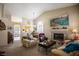 Inviting living room with fireplace, vaulted ceilings, and cozy seating arrangement at 8437 Cinnamon Hill Ave, Las Vegas, NV 89129