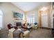 Cozy living room with plush seating, fireplace, and a welcoming atmosphere at 8437 Cinnamon Hill Ave, Las Vegas, NV 89129